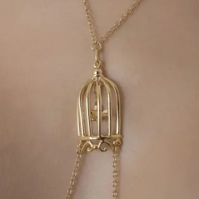 Ain't It Strange - Women's Bird in a Cage Neck Breast Chain and Non-Piercing Nipple Rings in Gold