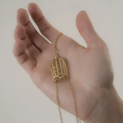 Ain't It Strange - Women's Bird in a Cage Neck Breast Chain and Non-Piercing Nipple Rings in Gold