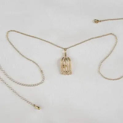 Cold Case Love - Gold Waist Chain with Bird in a Cage Pendant