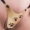 Pussy Galore - Goldener G-String mit Katzenpfotenmotiv und einführbarem Vaginalball